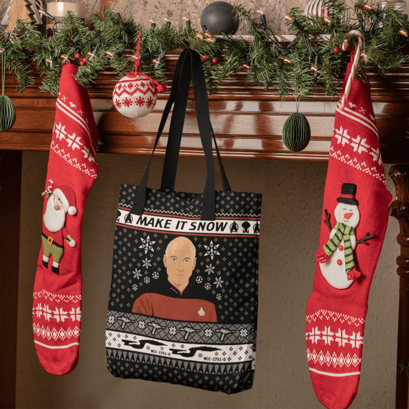 mockup of a tote bag hanging between christmas stockings 30193