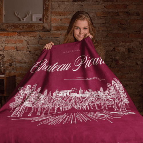 throw blanket mockup featuring a girl sitting on a bed 24677