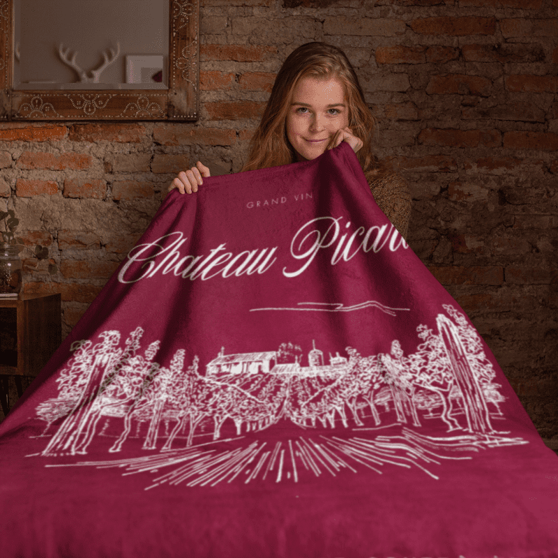 throw blanket mockup featuring a girl sitting on a bed 24677